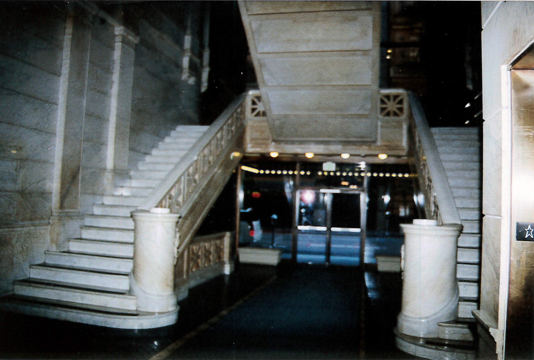 Lobby entrance facing towards Spring Street featuring original marble on walls and stairs